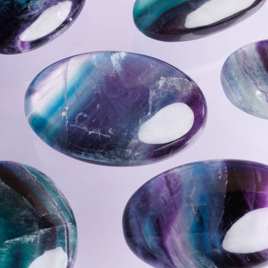 Close-up of colorful gemstones with a white background